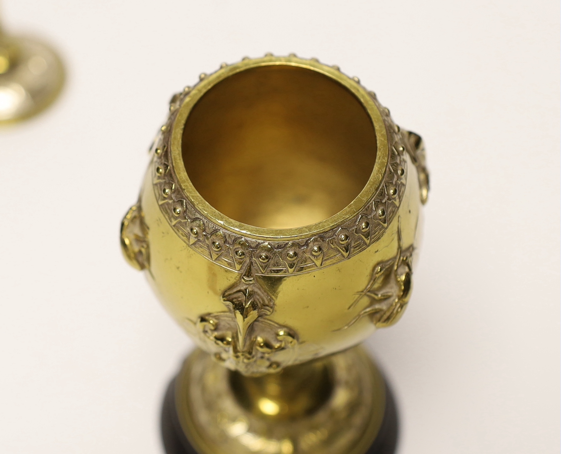 A brass and plated goblet and cover raised on circular slate base, body signed A Cain, 25cm high